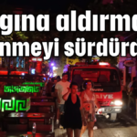 Yangına aldırmayıp eğlenmeyi sürdürdüler