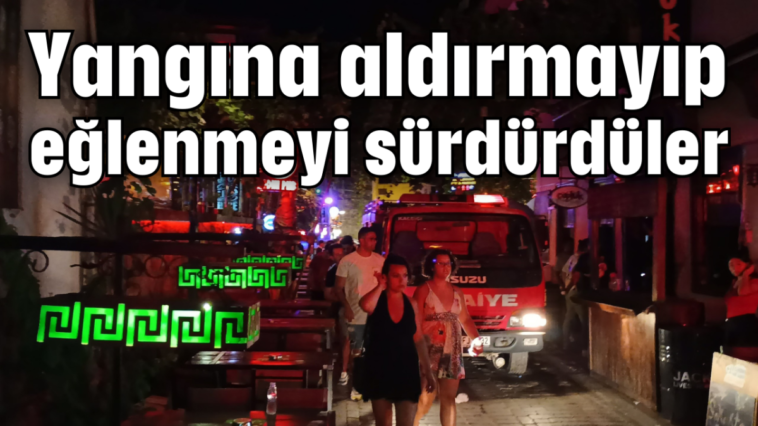 Yangına aldırmayıp eğlenmeyi sürdürdüler